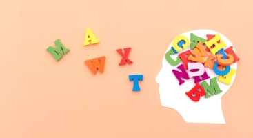 wooden letters coming out of a head.