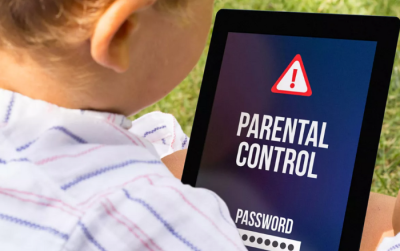 Child looking at a tablet reading "parental control"