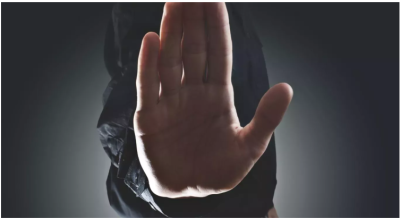 close up of a person's palm - as if to say "stop"