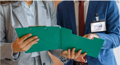 Ofsted inspectors holding green clipboard