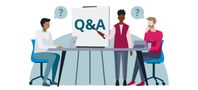 People sat around a desk with a flipchart saying Q&A