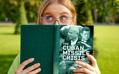 Woman reading book on the cuban missile crisis