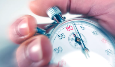 Person holding a classic stopwatch